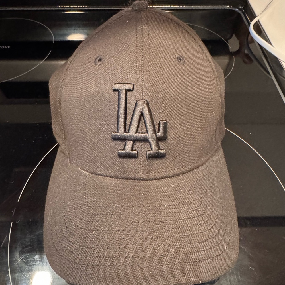 New Era Black Cap with Genuine Merchandise Logo